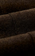 Close-up of dark brown textured fabric with a soft, fuzzy surface and layered folds.
