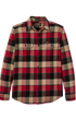 A long-sleeve plaid flannel shirt by Flannel, featuring a red, black, and beige checkered pattern, with two buttoned chest pockets and a button-down front.